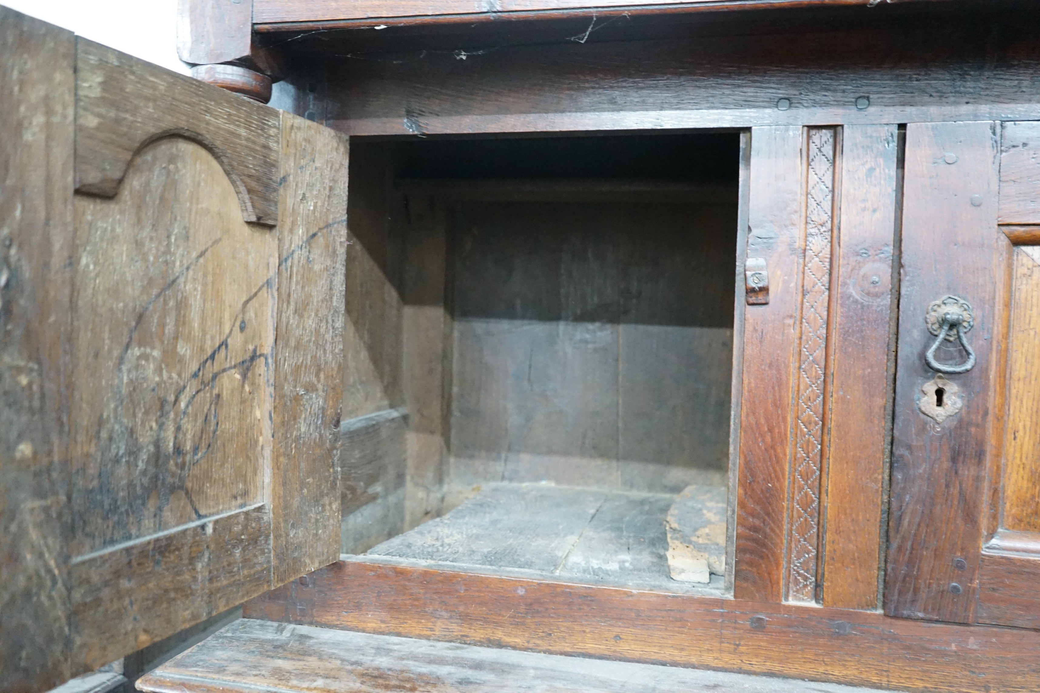 A mid 18th century oak court cupboard, initialled MR and dated 1744, width 155cm, depth 57cm, height 181cm